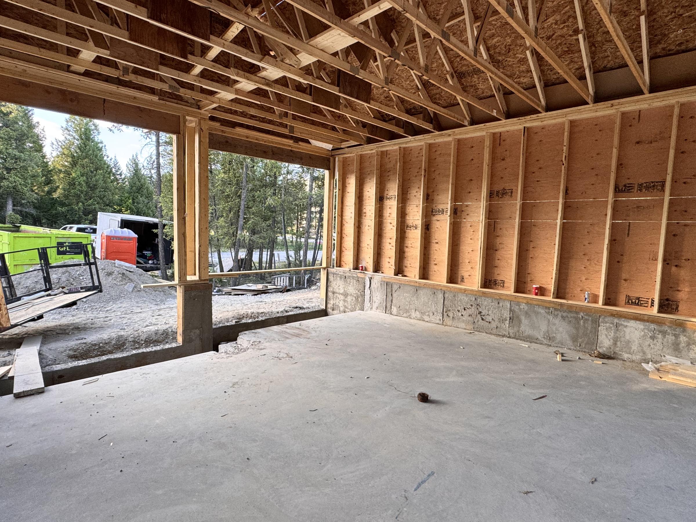 Interior of a framed garage showing joists and studs